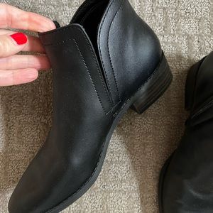Woman’s black leather booties